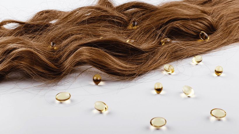 How does Vitamin E help in hair growth